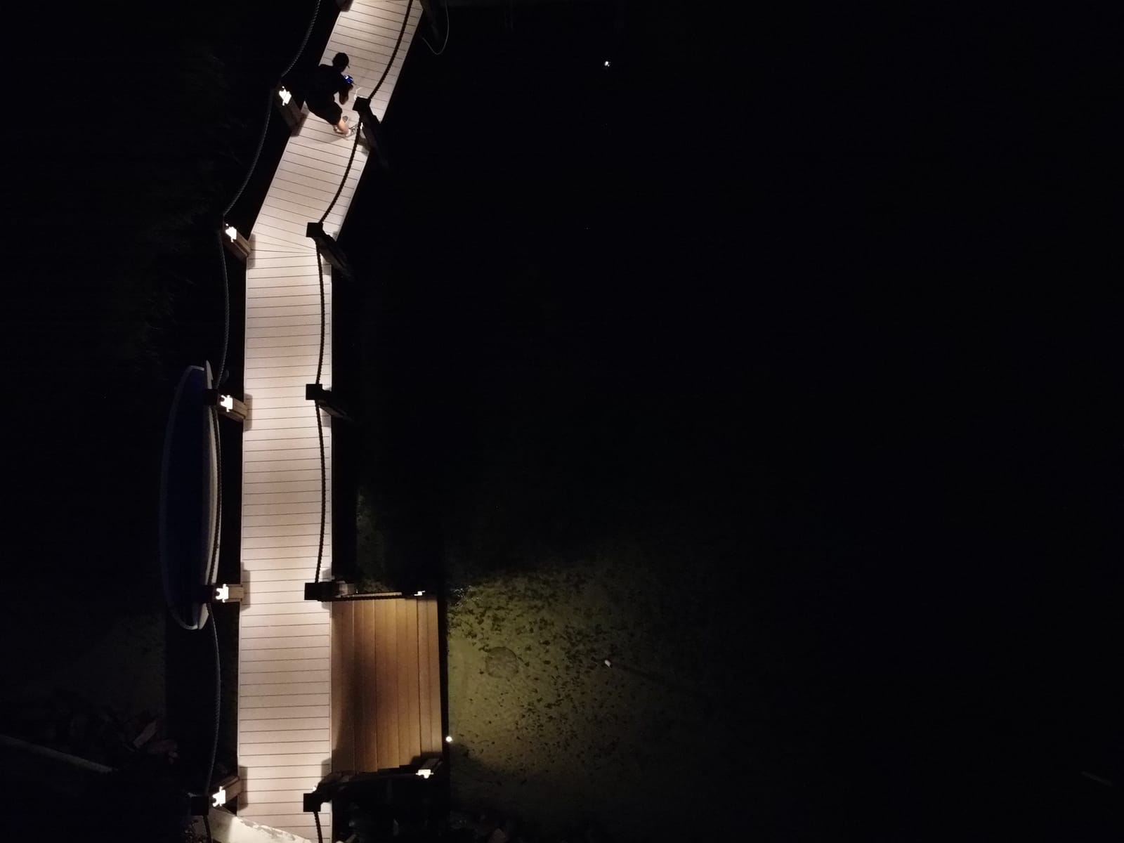 Before — dark dock at night with no underwater lighting