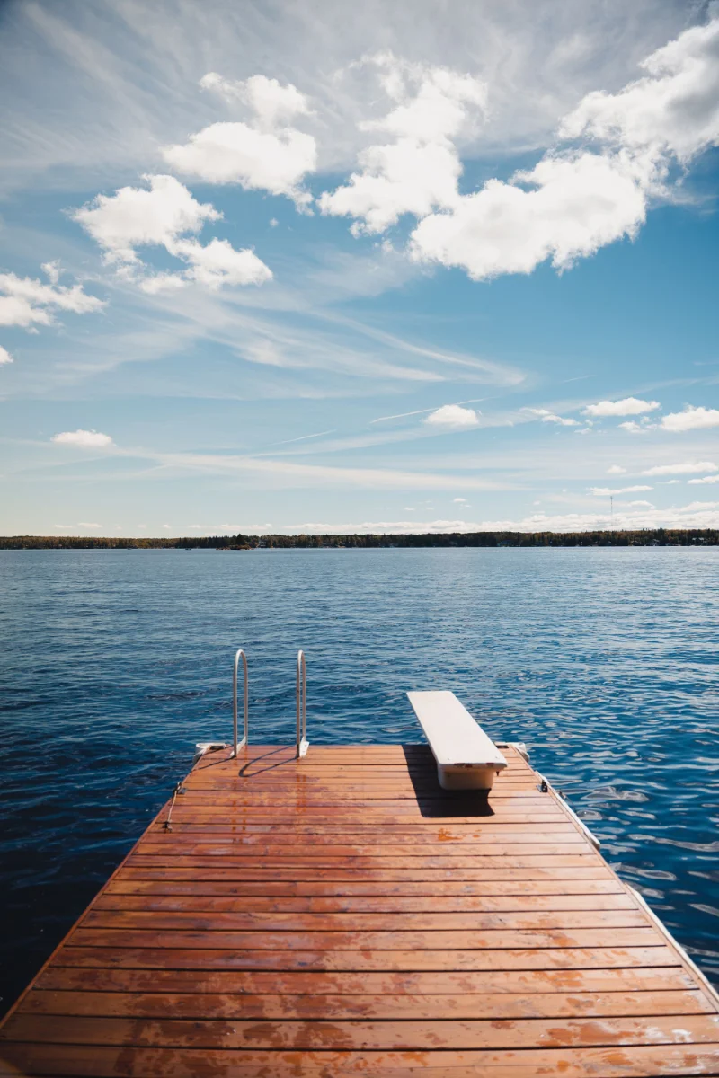 Clean blue-water Central Florida lakefront with a dock