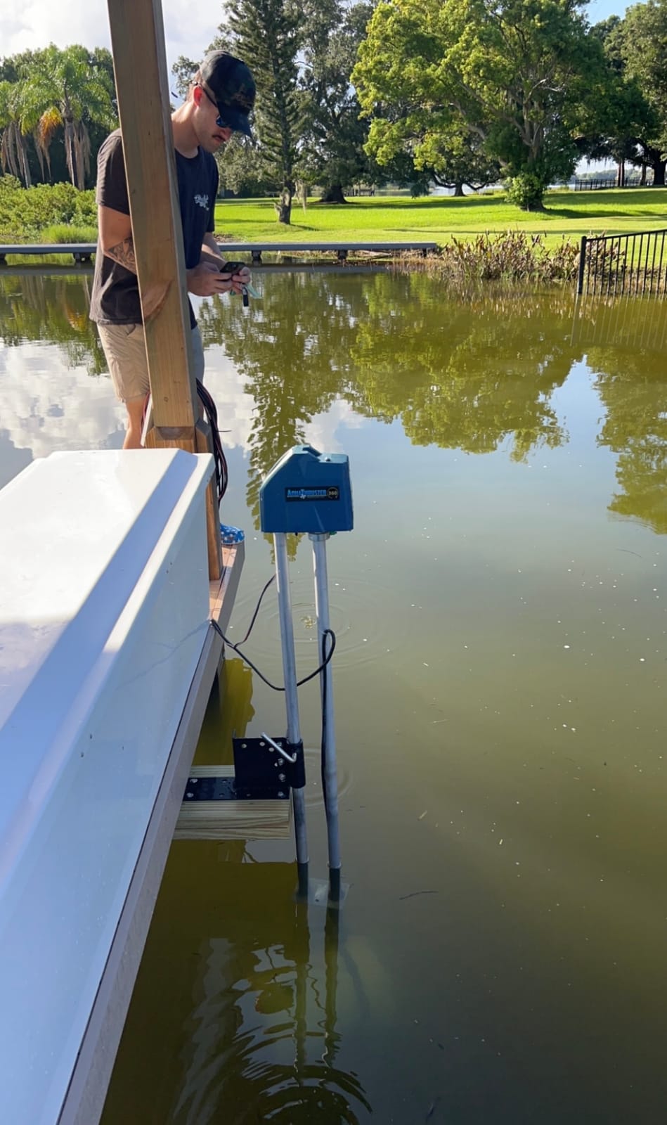 Shoreline Revival installer on a Central Florida dock setting up an AquaThruster