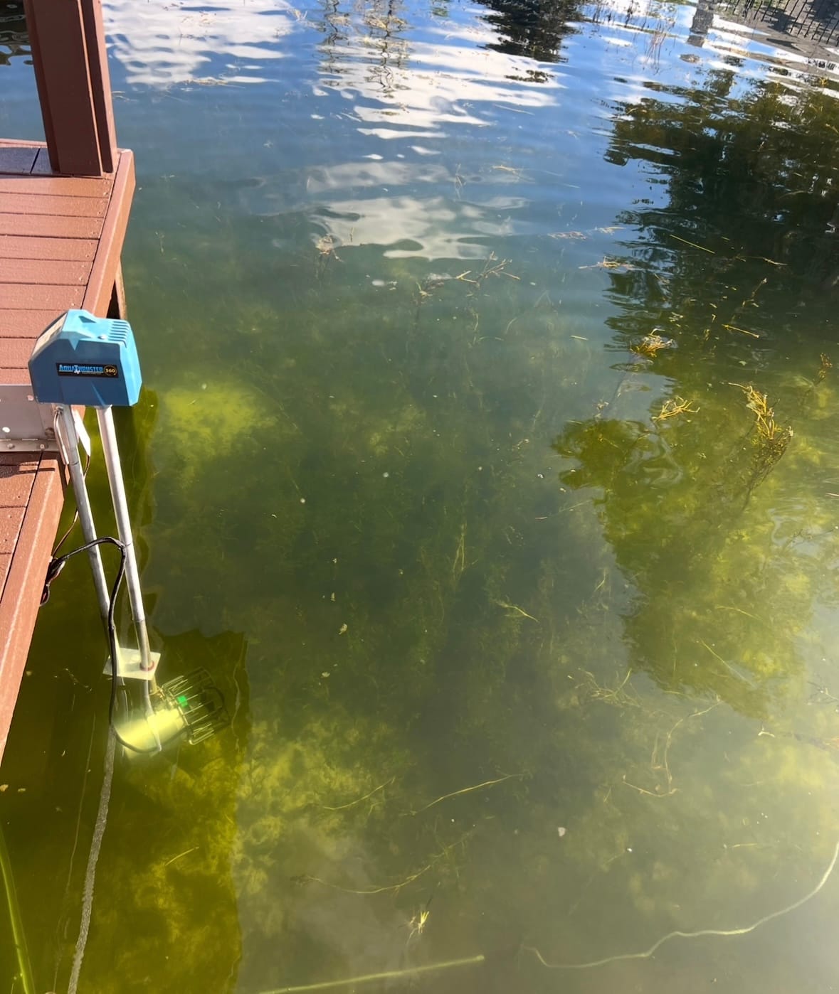 AquaThruster 360 running with its prop visible underwater, moving the water